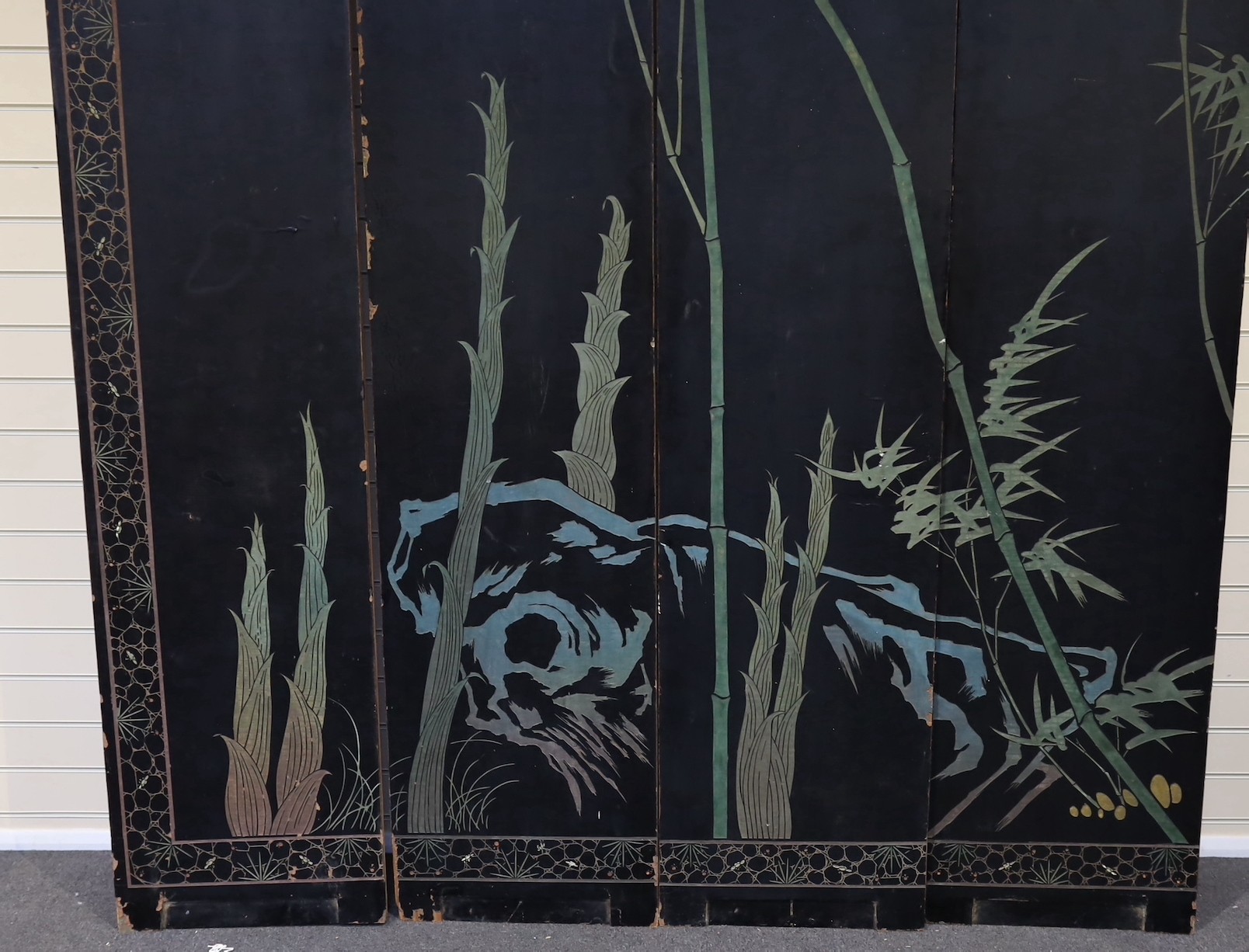 A tall Chinese coromandel lacquer twelve panel screen, 19th century, each leaf panel width 49cm, height 264cm
